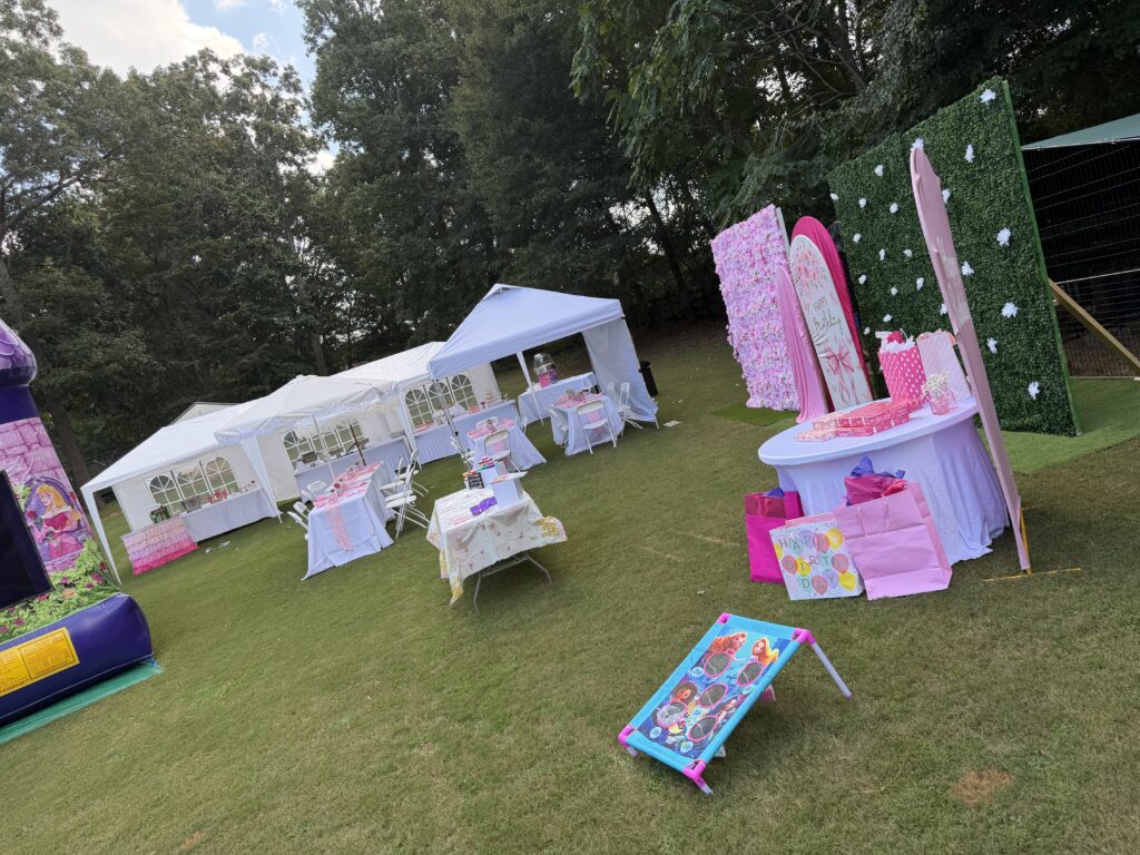 Outdoor party setup with tent and decorations