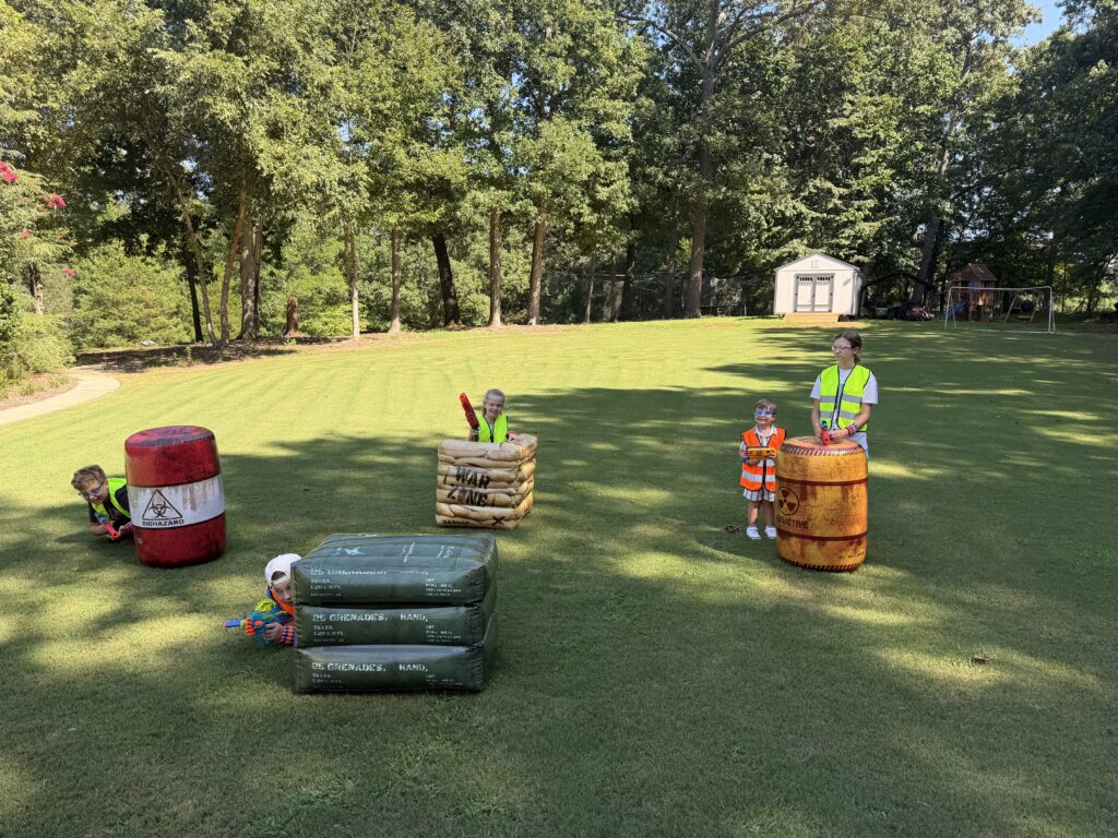 Outdoor event setup on a grassy lawn